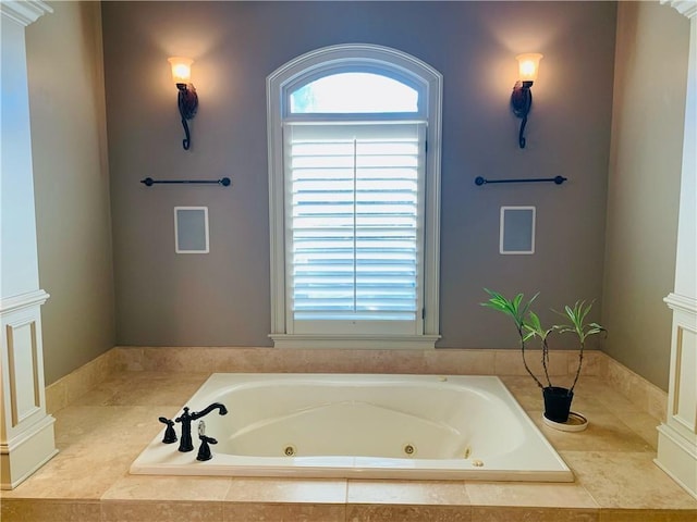 bathroom featuring a relaxing tiled tub