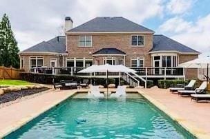 rear view of property featuring a patio area