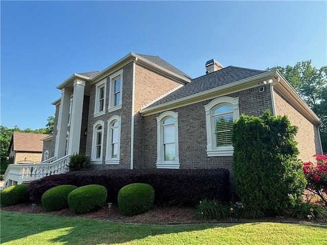 view of home's exterior featuring a lawn