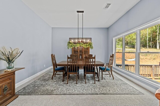 view of carpeted dining space