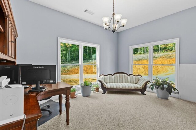 carpeted office featuring a chandelier