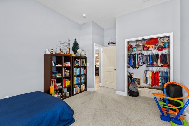 carpeted bedroom featuring a closet