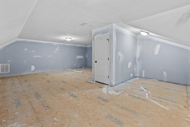 bonus room with vaulted ceiling