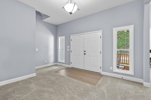 entrance foyer featuring carpet floors