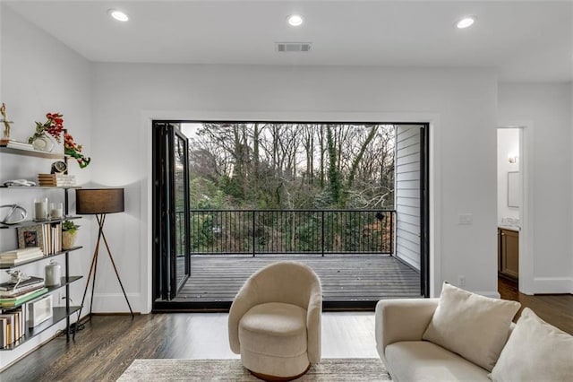 living area featuring dark hardwood / wood-style floors and a wealth of natural light