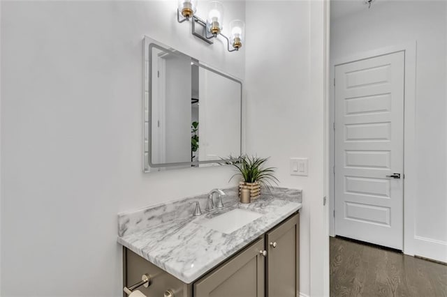 bathroom with vanity and wood-type flooring