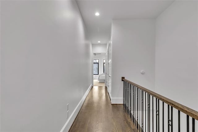 corridor featuring dark hardwood / wood-style flooring