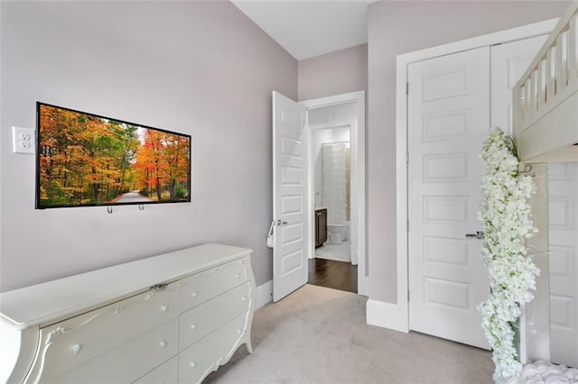 bedroom featuring light carpet