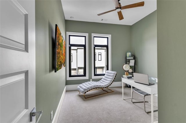 home office with light colored carpet and ceiling fan