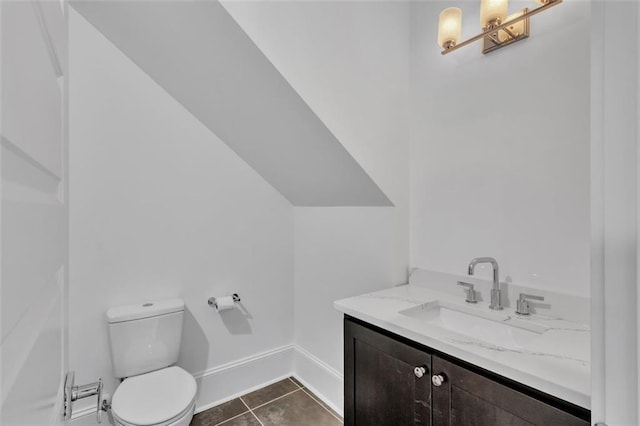 bathroom featuring tile patterned floors, toilet, and vanity