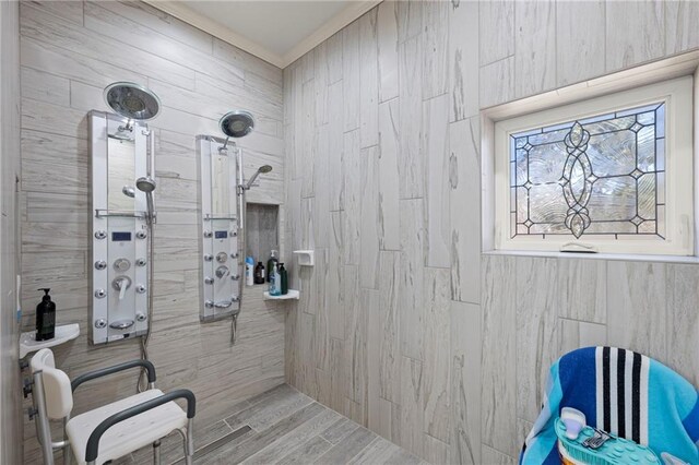 bathroom featuring wood-type flooring and tiled shower