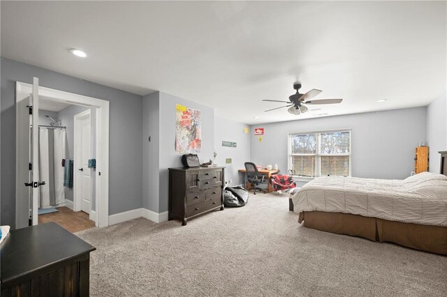 bedroom with ceiling fan and light colored carpet