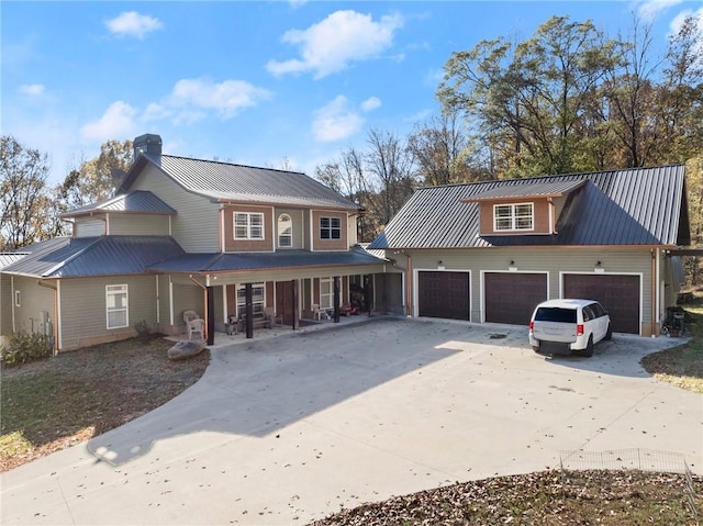 view of front facade with covered porch and a garage