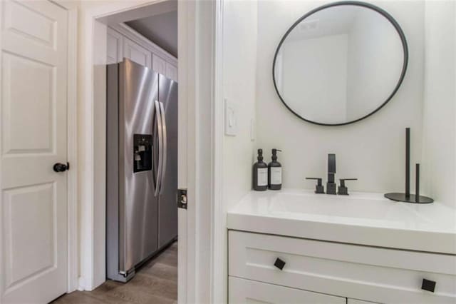 bathroom featuring vanity and wood-type flooring