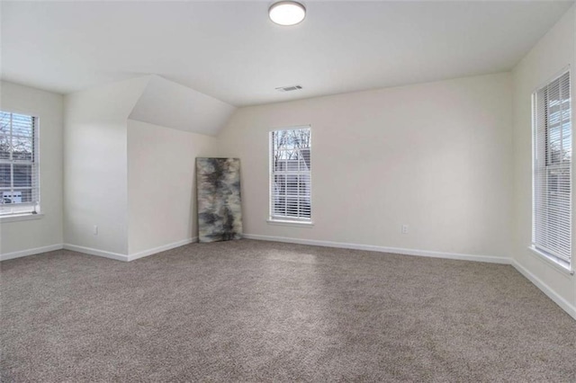 unfurnished living room with lofted ceiling and carpet flooring