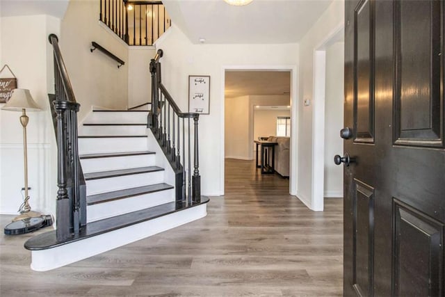 entryway with wood-type flooring