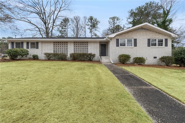 single story home featuring brick siding, crawl space, and a front yard