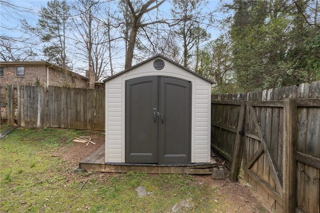 view of shed featuring a fenced backyard