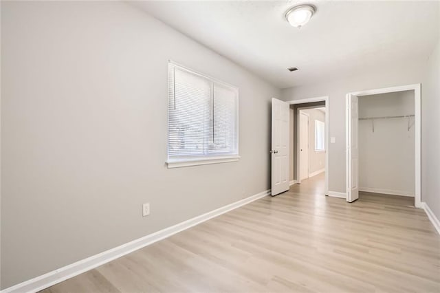 2638 Fieldstone View Ln SE, Conyers, GA 30013 - unfurnished bedroom featuring light wood-type flooring and a closet