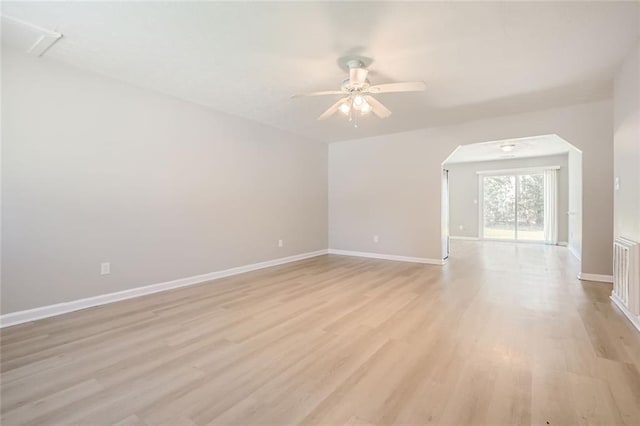 2638 Fieldstone View Ln SE, Conyers, GA 30013 - unfurnished room with ceiling fan, light wood-style flooring, and arched walkways