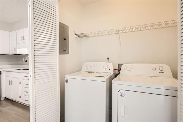 2638 Fieldstone View Ln SE, Conyers, GA 30013 - washroom featuring washing machine and dryer and light wood-style floors