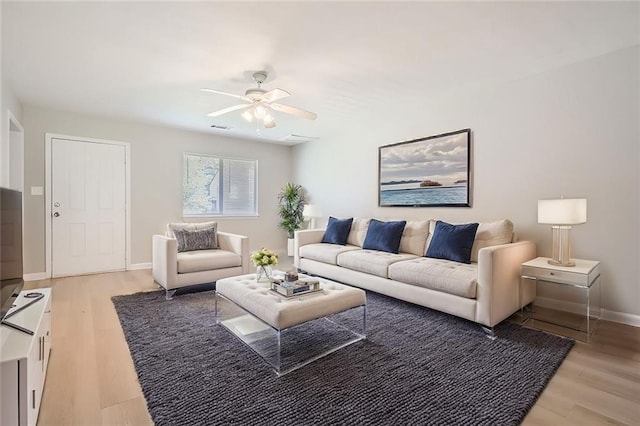 2638 Fieldstone View Ln SE, Conyers, GA 30013 - living area featuring ceiling fan and light wood-style floors
