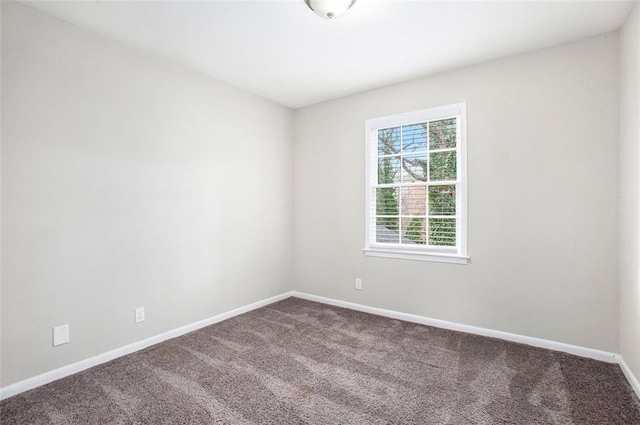 unfurnished room featuring carpet flooring