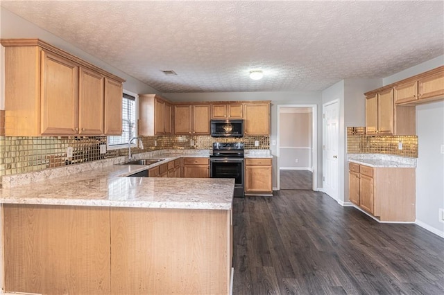 1241 Hogan Ridge Ct, Grayson, GA 30017 - kitchen featuring stainless steel microwave, range with electric cooktop, light countertops, dark wood-style floors, and a textured ceiling