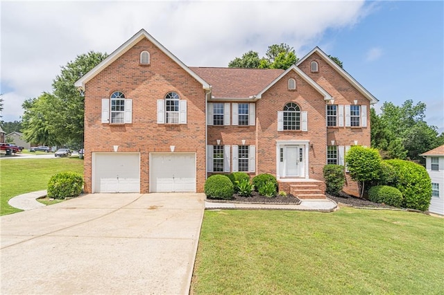 1241 Hogan Ridge Ct, Grayson, GA 30017 - view of front of house featuring driveway, a front lawn, a garage, and brick siding