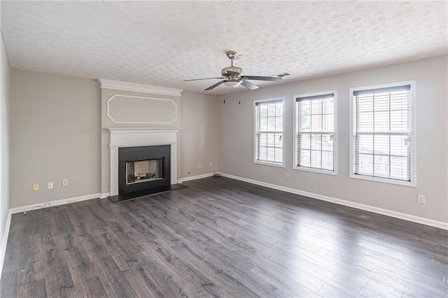 1241 Hogan Ridge Ct, Grayson, GA 30017 - unfurnished living room featuring ceiling fan, dark wood-style flooring, baseboards, and a fireplace with raised hearth