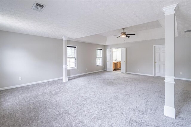 1241 Hogan Ridge Ct, Grayson, GA 30017 - unfurnished room with decorative columns, carpet flooring, a ceiling fan, a textured ceiling, and baseboards