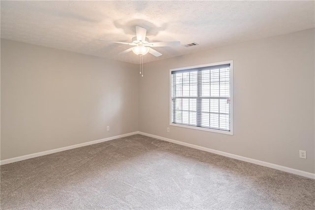 1241 Hogan Ridge Ct, Grayson, GA 30017 - carpeted spare room with a ceiling fan, baseboards, and a textured ceiling