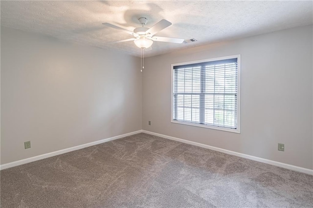 1241 Hogan Ridge Ct, Grayson, GA 30017 - carpeted spare room with a textured ceiling, a ceiling fan, and baseboards