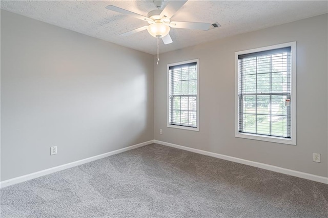 1241 Hogan Ridge Ct, Grayson, GA 30017 - carpeted empty room featuring a textured ceiling, ceiling fan, and baseboards