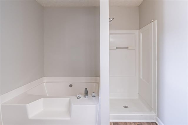 1241 Hogan Ridge Ct, Grayson, GA 30017 - full bath with a garden tub, a shower, and a textured ceiling