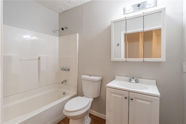 1241 Hogan Ridge Ct, Grayson, GA 30017 - bathroom featuring toilet, vanity, tub / shower combination, a textured ceiling, and baseboards