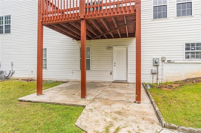 1241 Hogan Ridge Ct, Grayson, GA 30017 - doorway to property featuring a carport, a yard, and a patio area