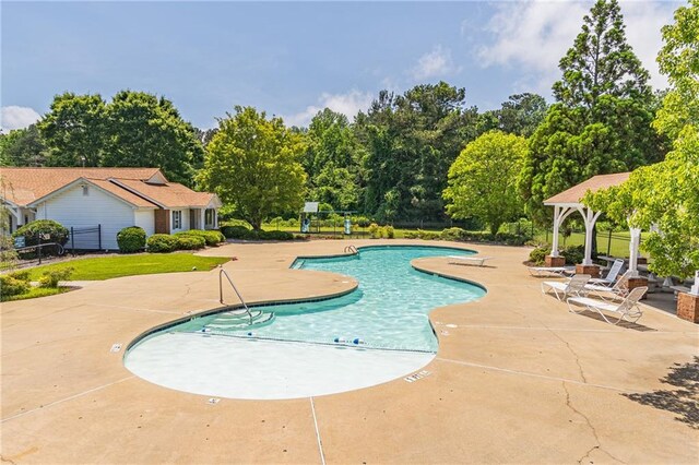 1241 Hogan Ridge Ct, Grayson, GA 30017 - community pool with a patio area, a gazebo, and view of wooded area