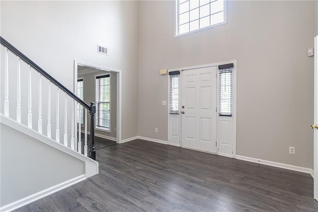 1241 Hogan Ridge Ct, Grayson, GA 30017 - entrance foyer with a high ceiling, stairway, wood finished floors, and baseboards