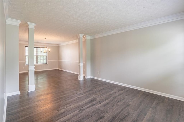 1241 Hogan Ridge Ct, Grayson, GA 30017 - spare room with ornate columns, a chandelier, dark wood-type flooring, a textured ceiling, and baseboards