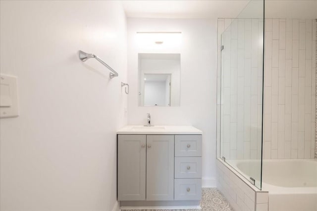 bathroom with vanity and tiled shower / bath combo