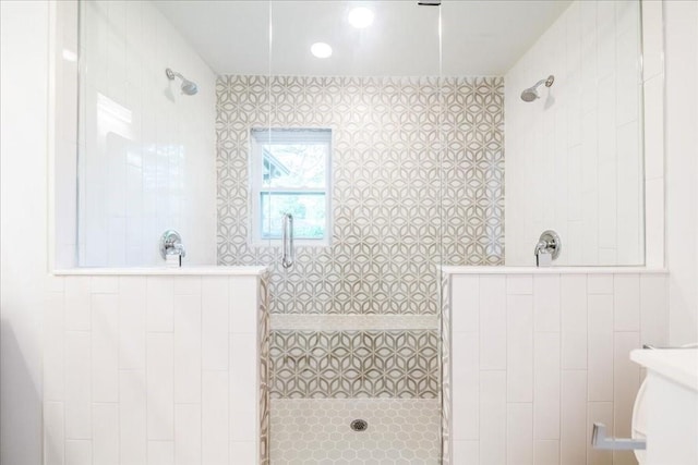 bathroom with a tile shower