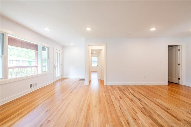 unfurnished room featuring light hardwood / wood-style floors