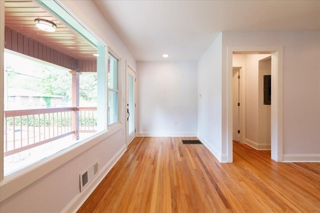 unfurnished room with light wood-type flooring