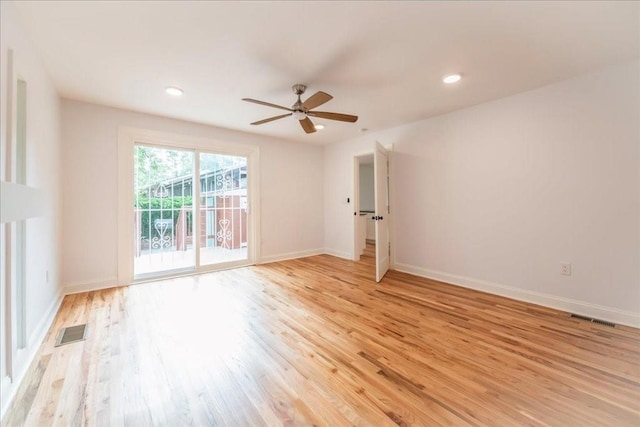 empty room featuring ceiling fan and light wood-type flooring