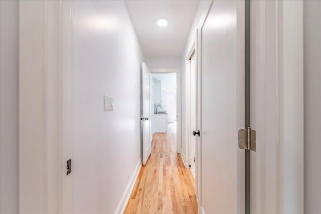 hallway featuring light wood-type flooring