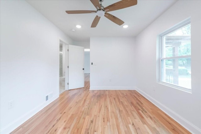 empty room with light hardwood / wood-style floors