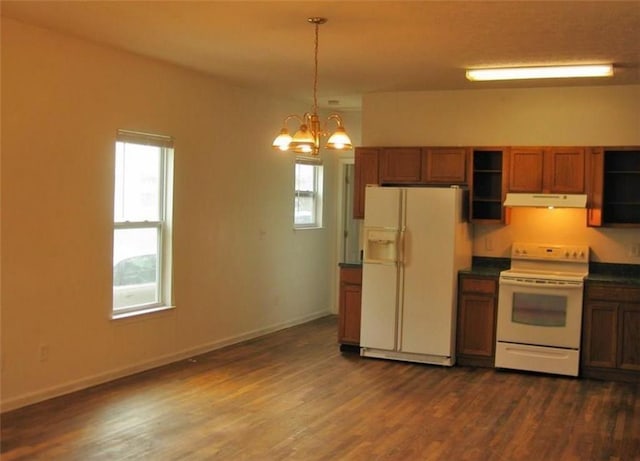 kitchen featuring decorative light fixtures, white appliances, a chandelier, and dark hardwood / wood-style floors