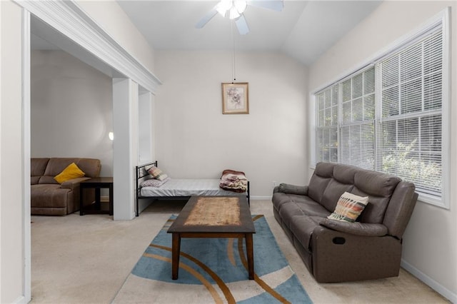 carpeted living room featuring lofted ceiling and ceiling fan