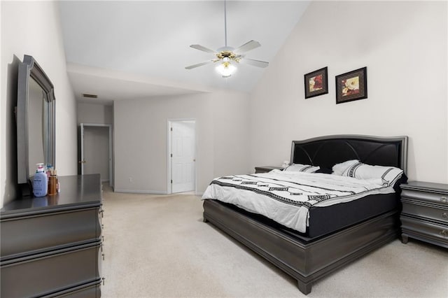 carpeted bedroom featuring vaulted ceiling and ceiling fan